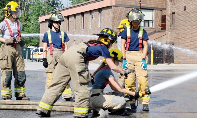 Local firefighter coaches girls at Camp FFIT